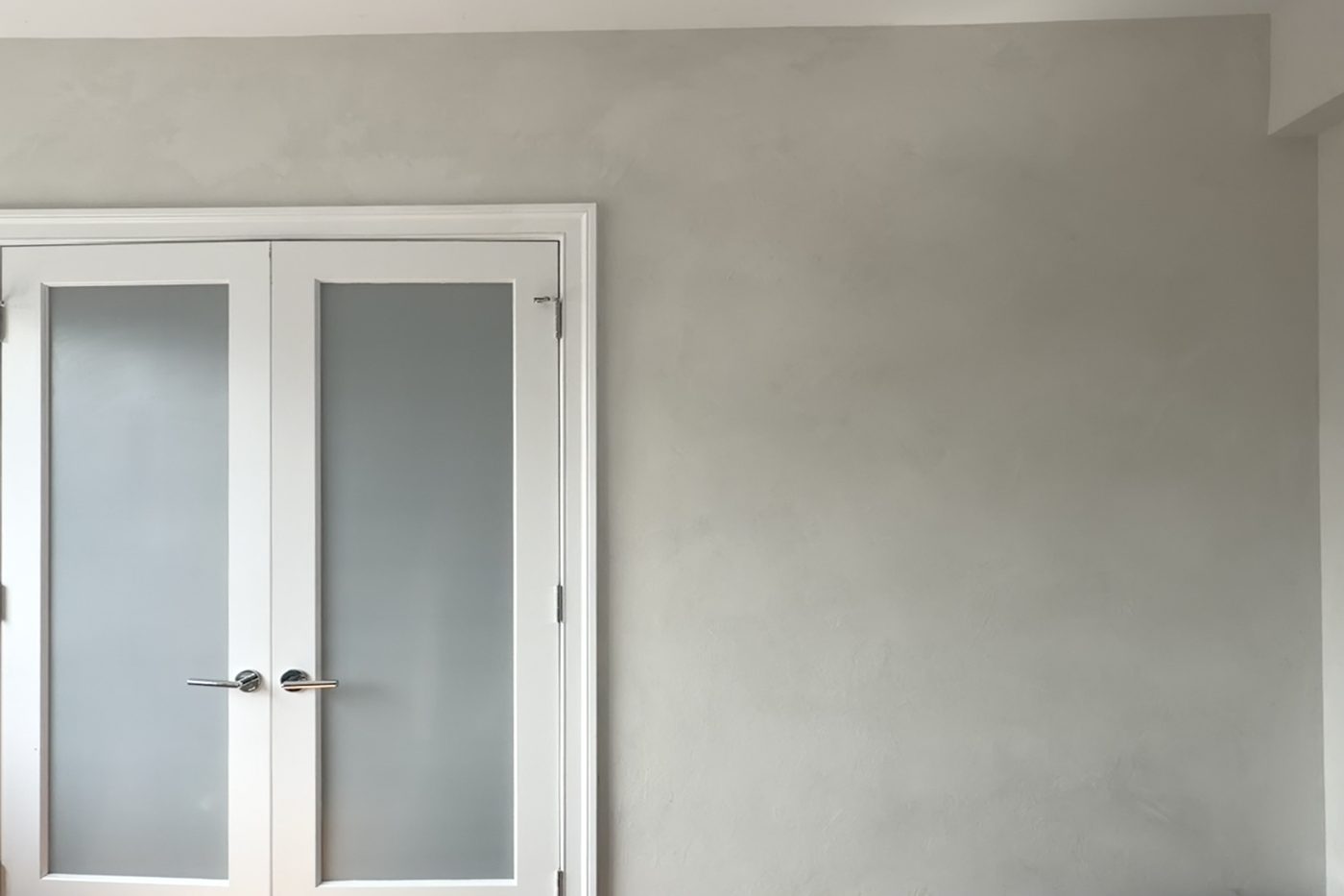 Grey hand-applied limewash with frosted double doors, Greenwich Village