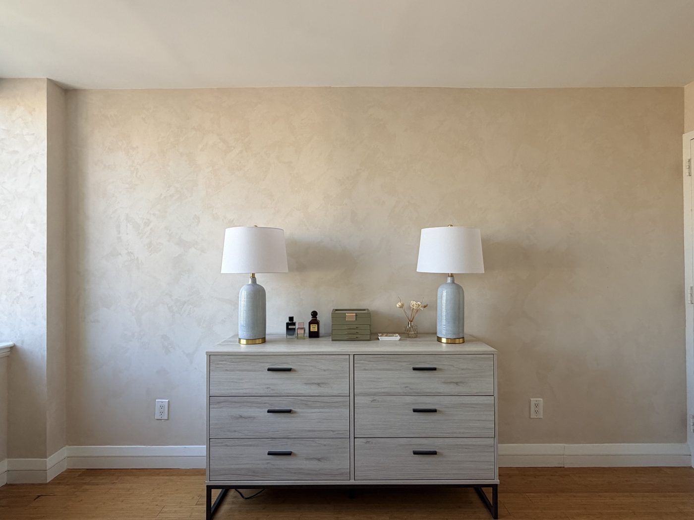 Limewash bedroom wall with soft mineral movement, NoMad